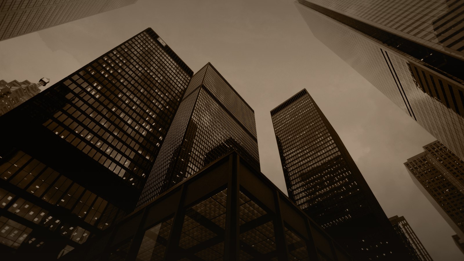 Sepia-toned photo of financial district towers seen from below